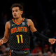 Trae Young #11 of the Atlanta Hawks reacts after hitting a three-point basket against the Orlando Magic in the first half at State Farm Arena on February 26, 2020, in Atlanta, Georgia.